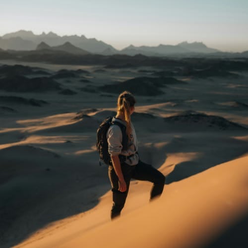 Woman hiking in the desert of NEOM, Saudi Arabia