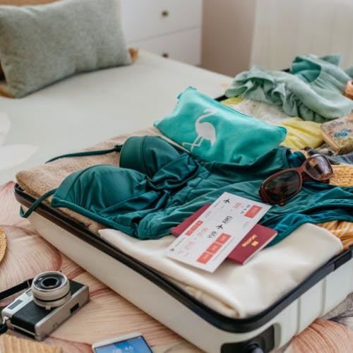 Open suitcase with clothes inside