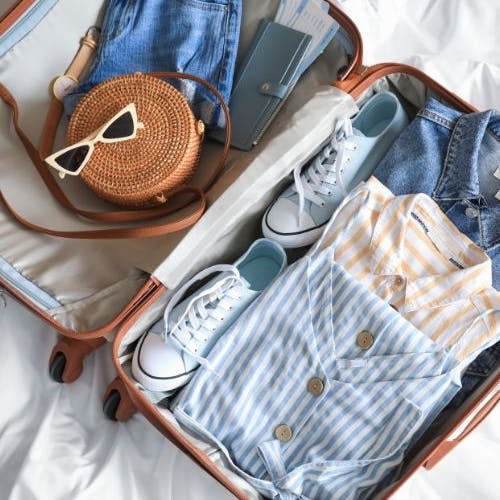 Open suitcase with clothes inside