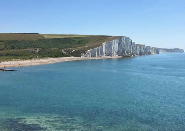 A shot of the Seven Sisters coastline showing chalk cliffs and beach. Taken on a sunny day 