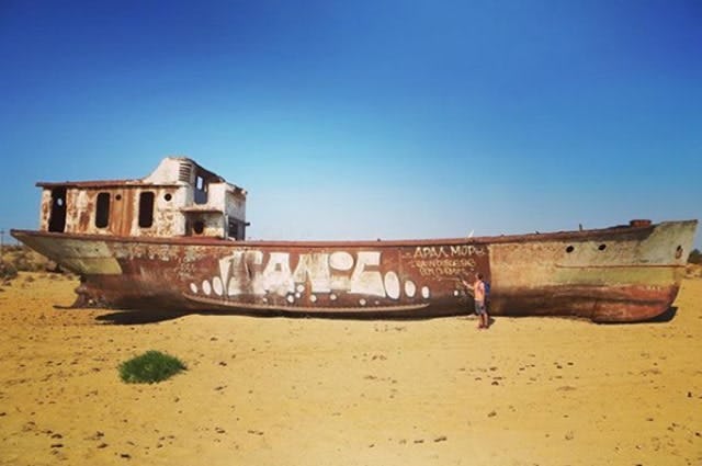 Boat on the dry Aral Sea in Uzbekistan