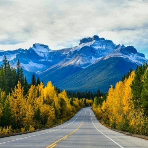 Road in Canada with mountains in background