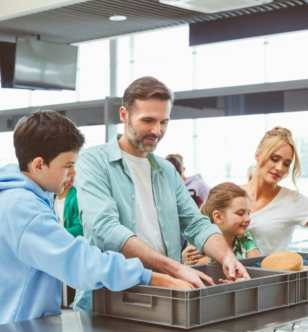 A family going through airport security together