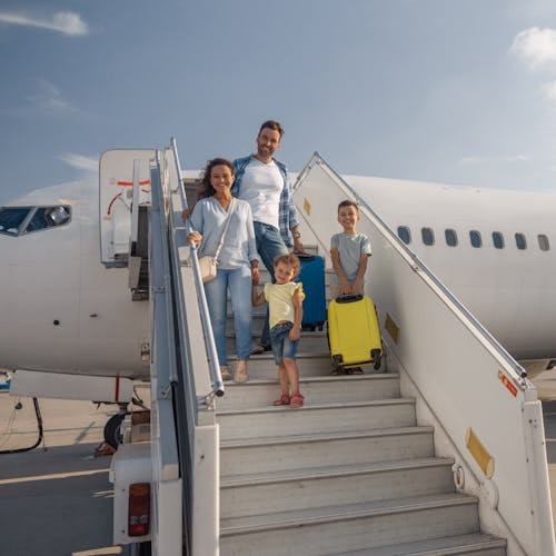 Family getting off aeroplane