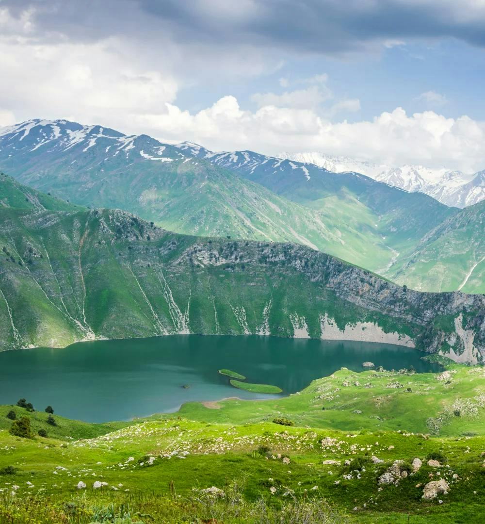Landscape in Kazakhstan, with a lake and mountains in the background