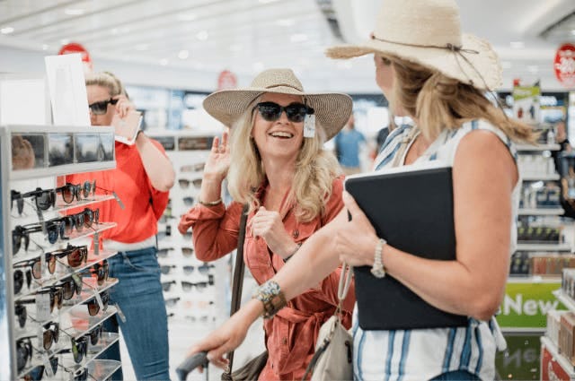Woman shopping for sunglasses