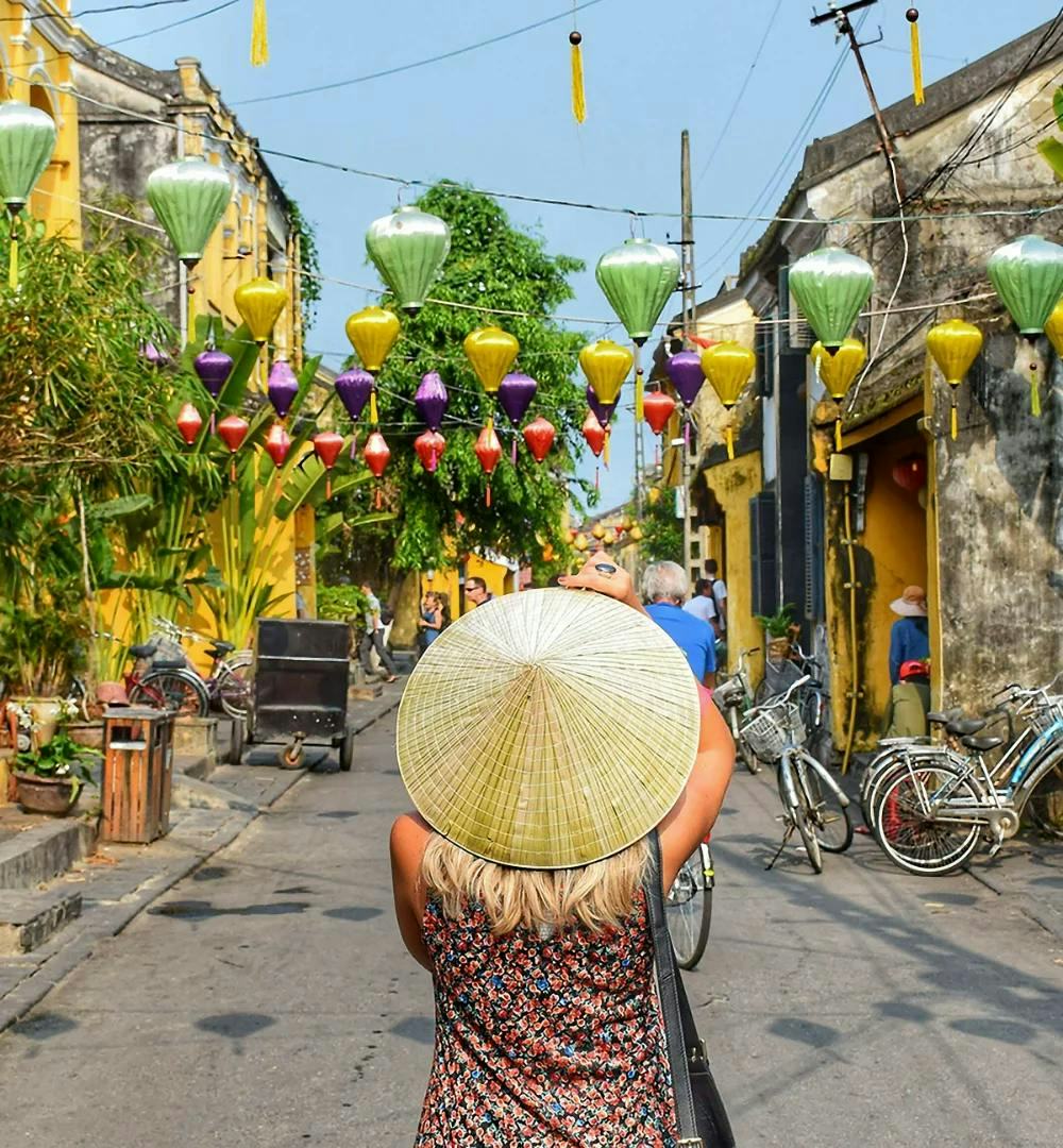 Lady wearing traditional Vietnamese hat in Hoi An