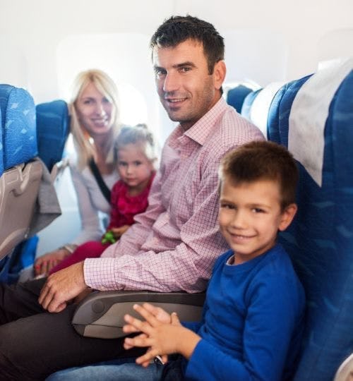 family sitting on plane 