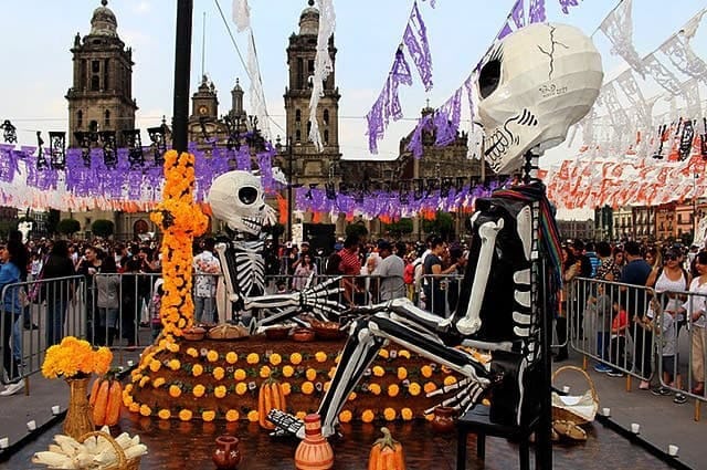 El Dia de los Muertos festivities in Mexico cities with skeleton puppets and crowds 