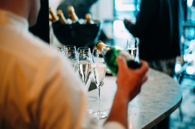 Picture of man pouring champagne