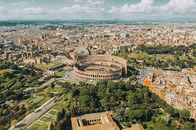 Bird's eye view of the Colosseum and the city of Rome. The Colosseum is one of the 7 wonders of the world.