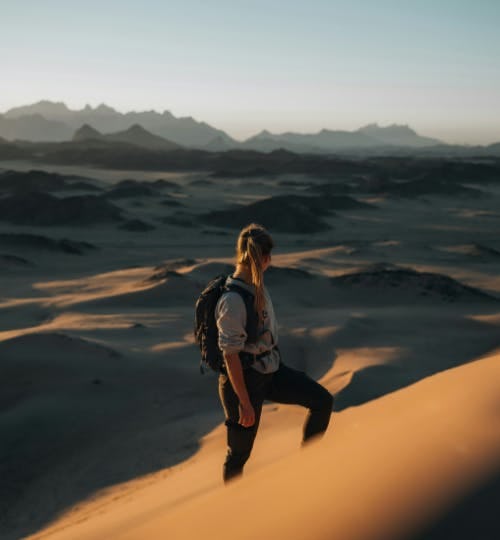 Woman hiking in the desert of NEOM, Saudi Arabia
