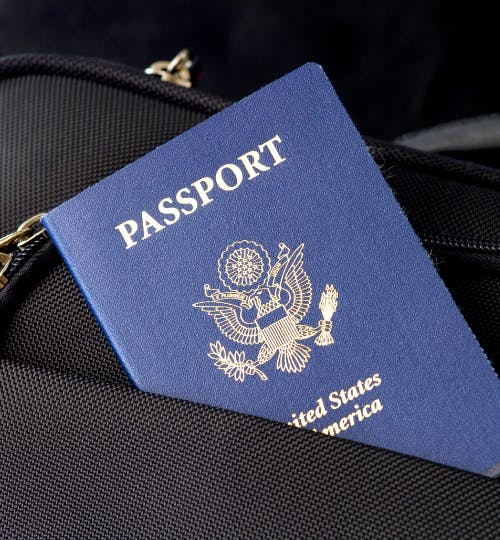 A US passport tucked in the pocket of a bag