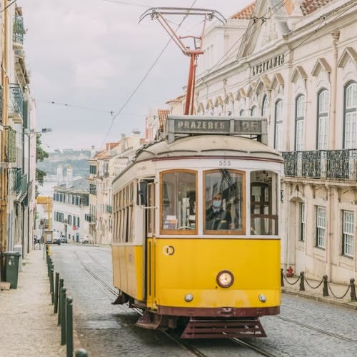 Yellow tram in Rua de São Domingos, Lisbon