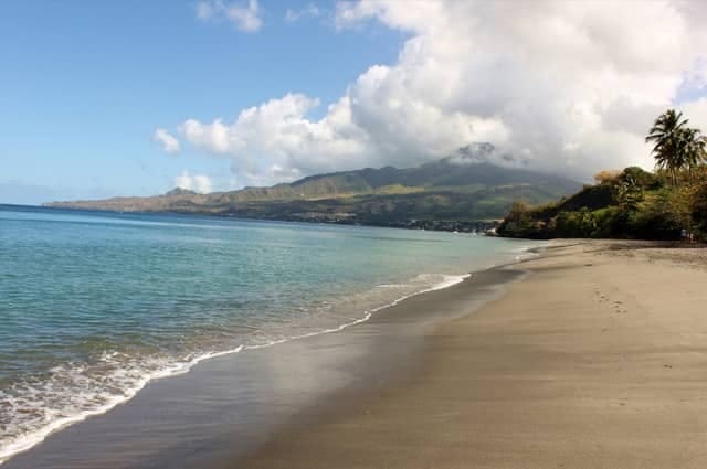 martinque beach in the caribbean with mount pelee in the background