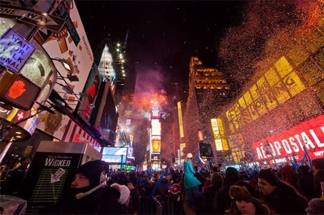 New York's Times Square celebrating new year with confetti raining down over the crowd