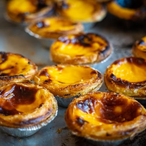 Pastel De Nata - a Portuguese egg tart pastry, dusted with cinnamon.