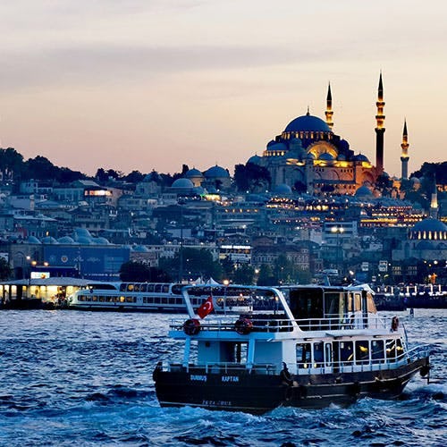 Boat on a river with Istanbul city in background