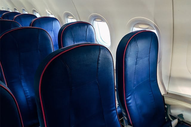 Leather aircraft seats with red piping 