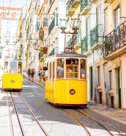 Lisbon, Portugal. Yellow tram on a hill.
