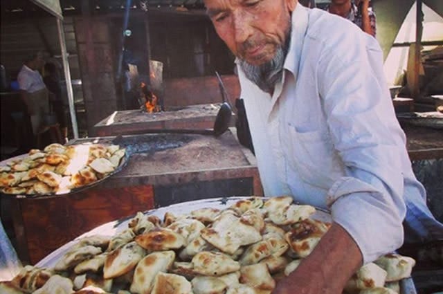 A shot of a street food seller in Kashgar 