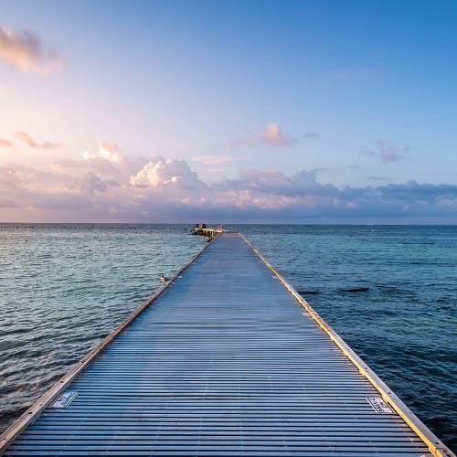 Key West boardwalk into ocean.