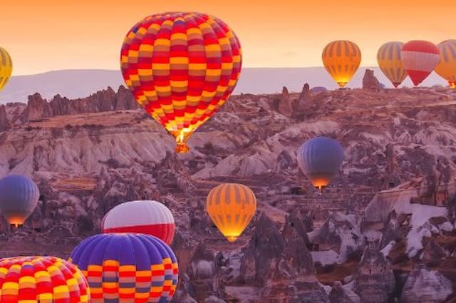 Hot air balloons taking off in Cappadocia, Turkey