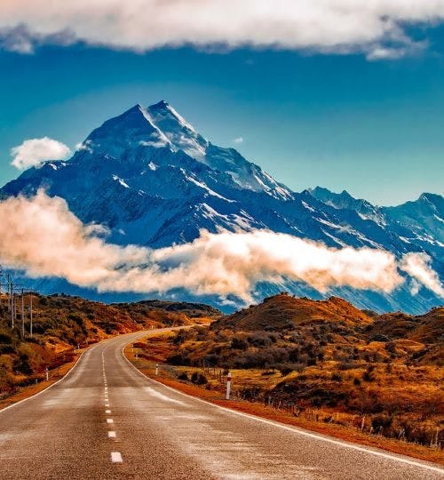 Road heading towards a mountainous area in New Zealand