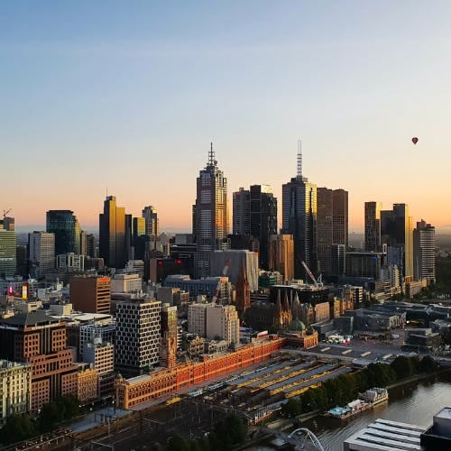 Skyline with sunrise and balloons, Melbourne, Australia