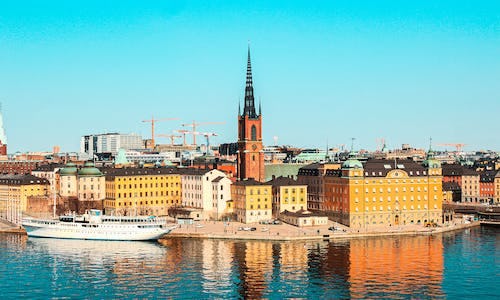 The skyline of Gamla Stan island in Stockholm with pastel coloured buildings 