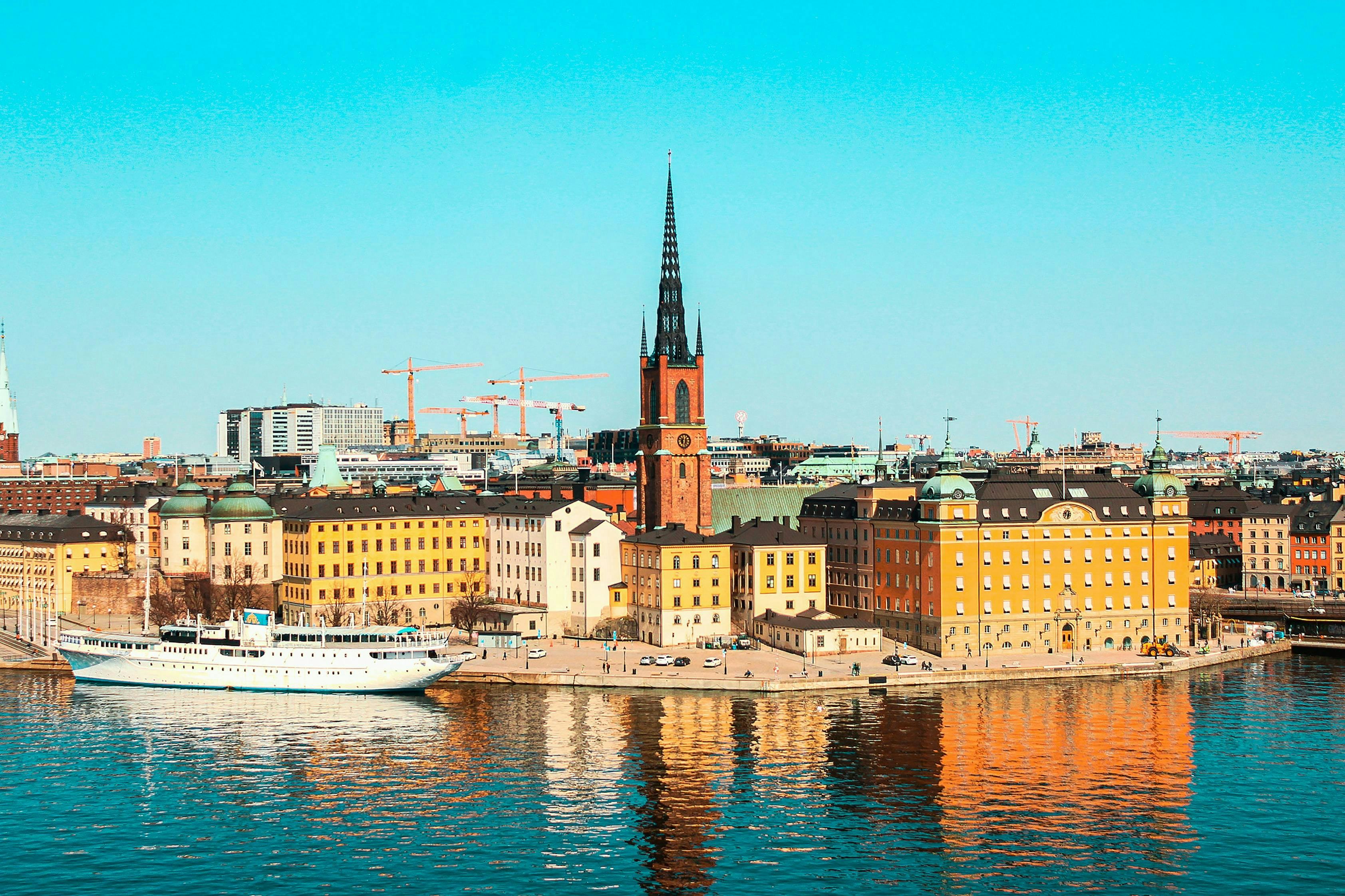 The skyline of Gamla Stan island in Stockholm with pastel coloured buildings 