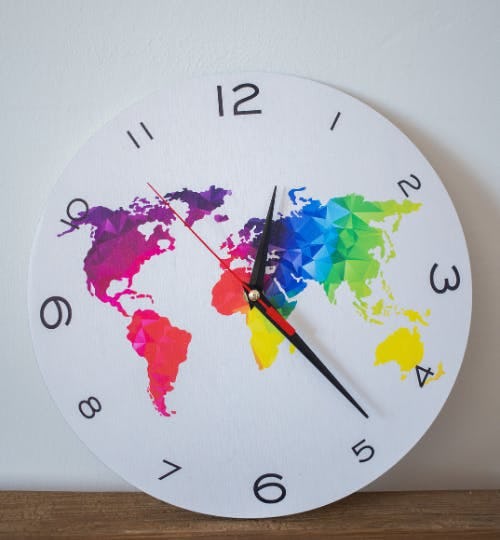Clock with a colourful world map on it