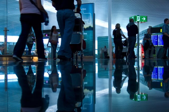 low level shot of passengers walking through a terminal