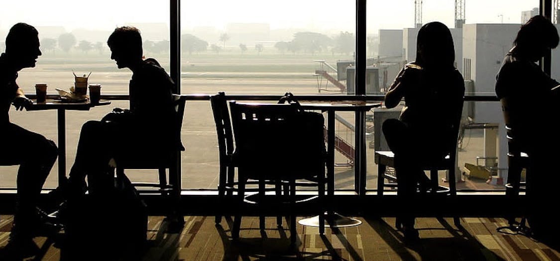 Picture of people sitting in a cafe at the airport
