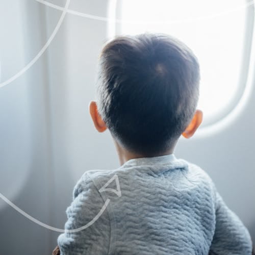 Child looking outside the plane window