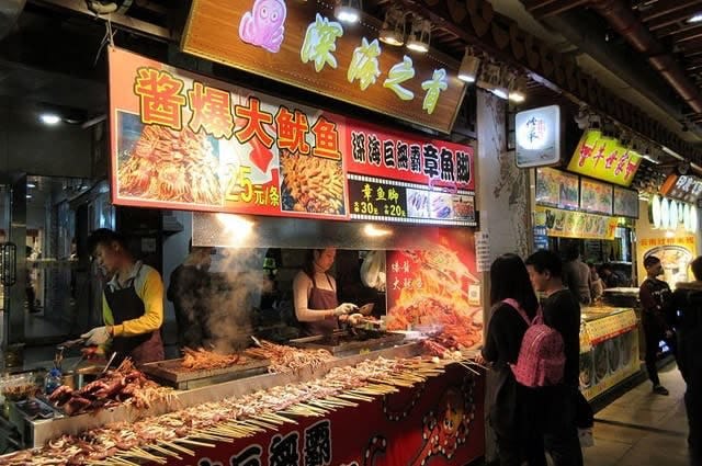 Dongmen market in Shenzhen with vendors selling a range of snacks and foods