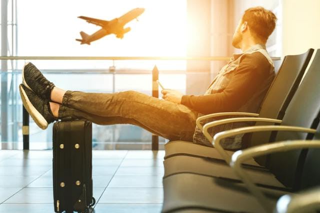 Man sitting in airport lounge waiting for flight