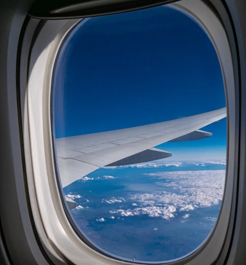 Plane wing out of window view