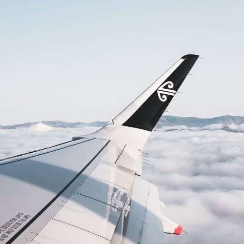 Air New Zealand aircraft wing above the clouds
