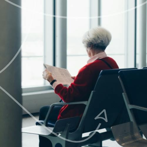 Elderly woman waiting in an airport terminal