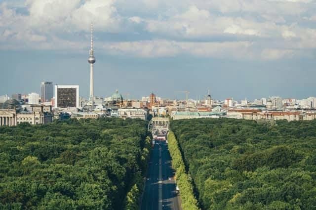 A city shot of Berlin during summer with lots of green trees