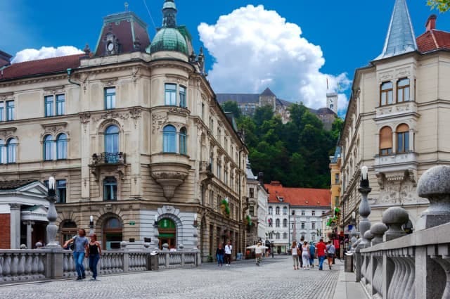 A photo highlighting the architecture of buildings in Ljubljana, including cobbled streets and red tiled roofs