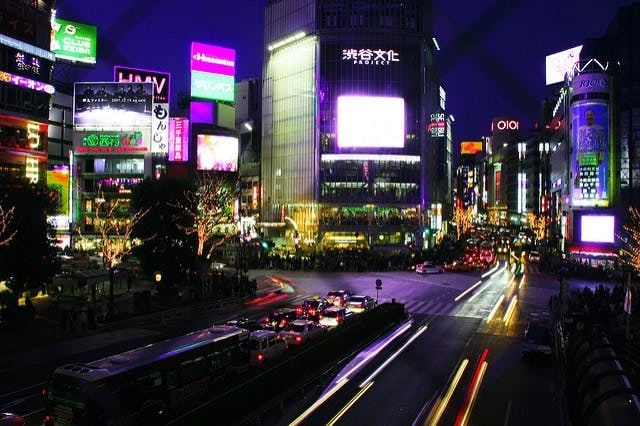 Central Tokyo lit up at night with neon and LED screens