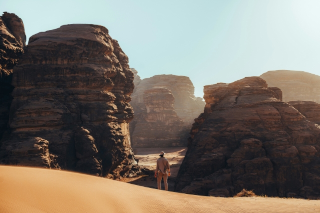 A man wandering through Saudi Arabian desert